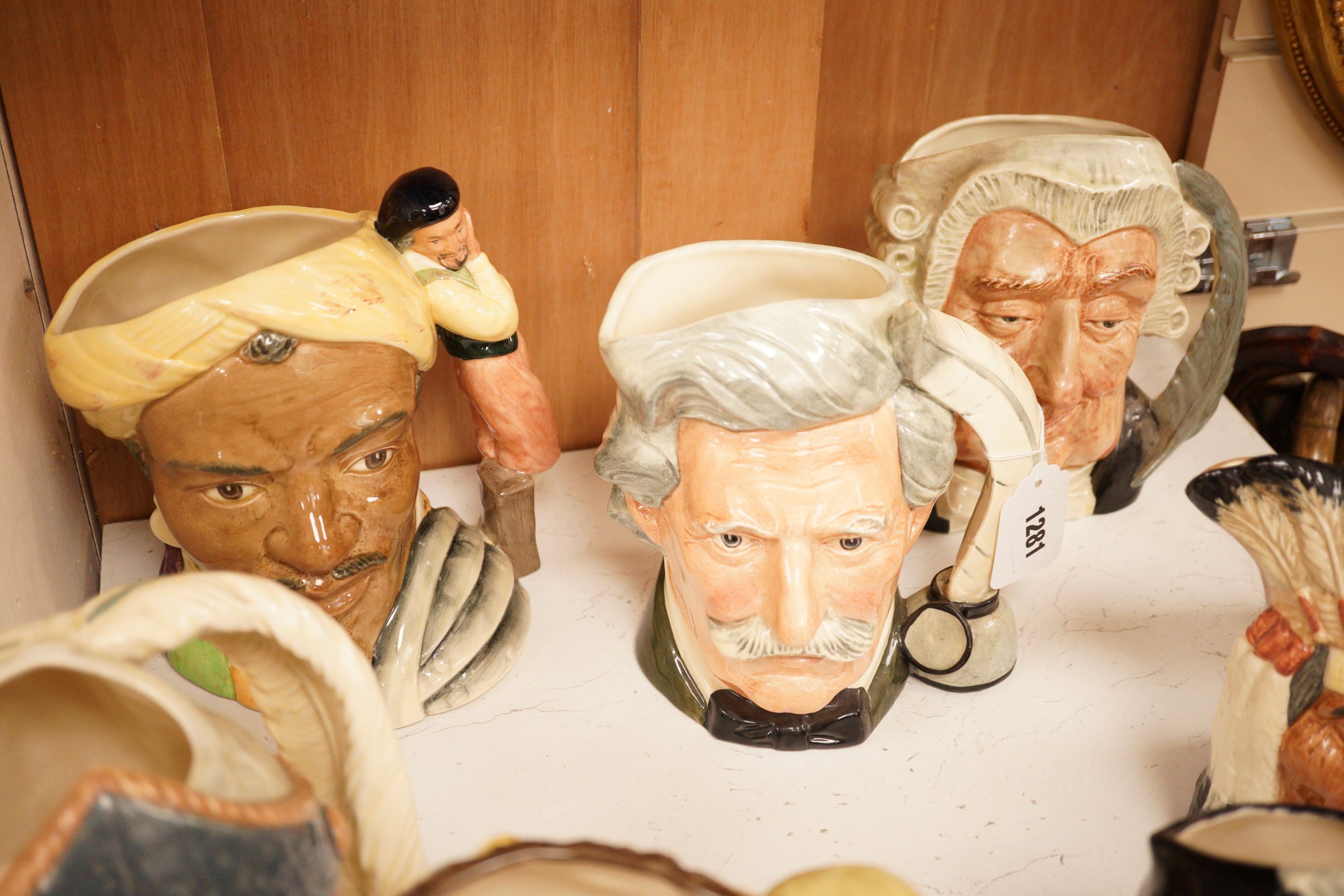 A group of seven various Doulton large character jugs